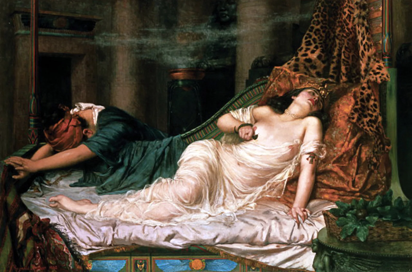 Reginald Arthur's painting of Cleopatra's death: she lies back on a low couch in white silk with a gold headdress, a leopard skin hung behind her, incense drifting from a burner, while a maid collapses face-down across the foot of the bed