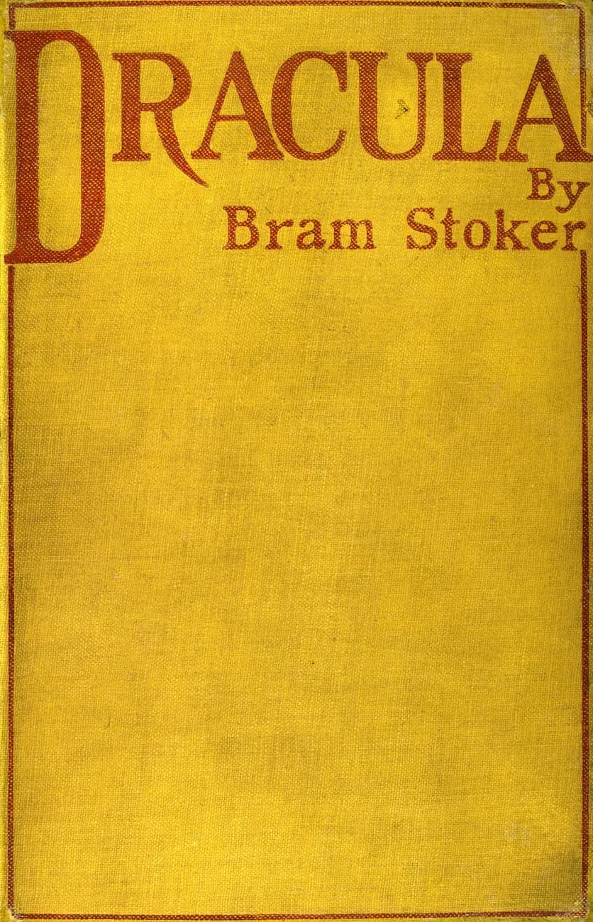 The yellow cloth cover of the 1897 first edition of Dracula by Bram Stoker, with the title and author lettered in red and no other artwork
