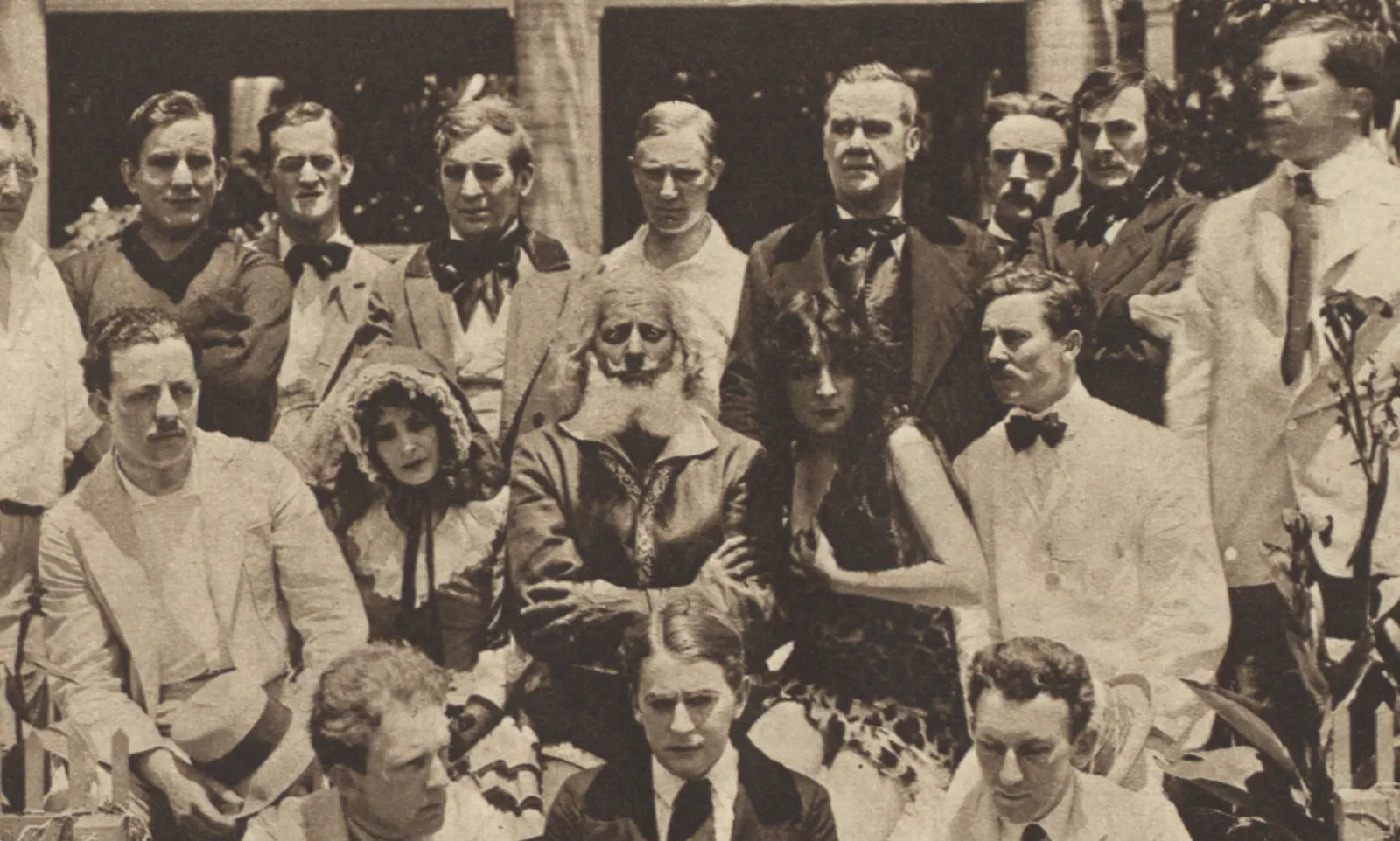 A 1916 press photograph of the Universal film crew who shot the first screen version, posed on deck with diving gear and camera equipment
